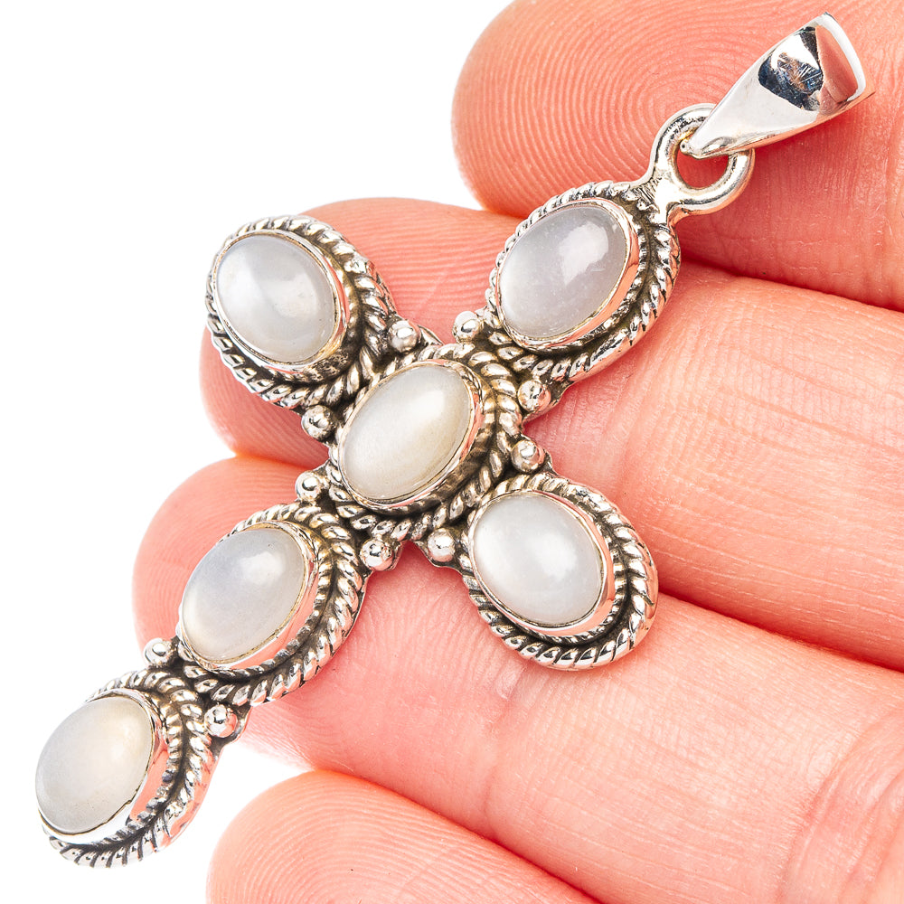 Sterling silver cross pendant with five oval opalescent moonstone-style stones