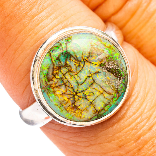 Round opal cabochon sterling silver ring with green and gold veining