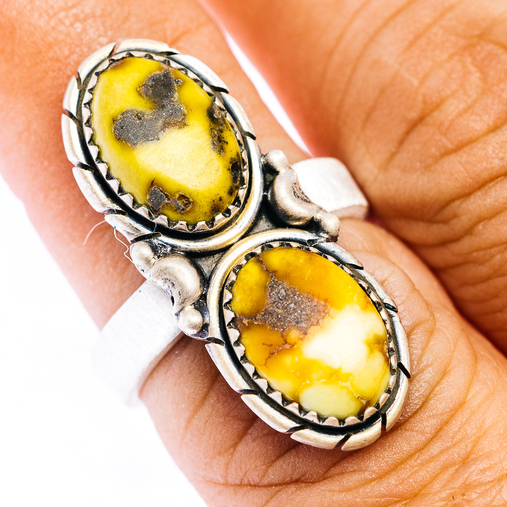 Adjustable sterling silver ring with two oval yellow stones in southwestern setting