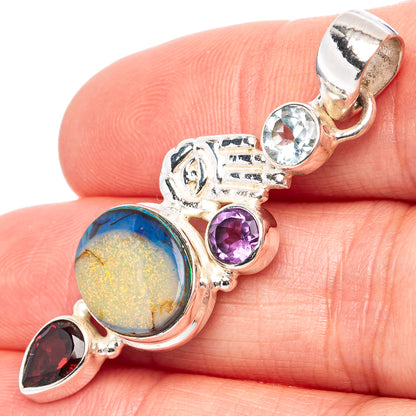 Sterling silver pendant with opal-style stone, blue topaz, purple amethyst, dark red gem