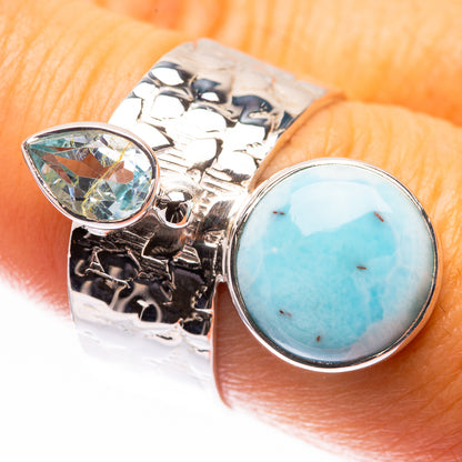 Sterling silver ring with oval blue topaz and round blue larimar stones