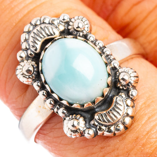 Sterling silver oval larimar ring with ornate beaded bezel and light blue stone