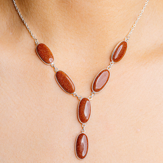 Sterling silver necklace with five oval gemstone pendants
