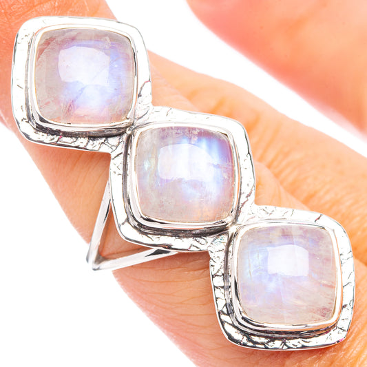 Sterling silver three-stone ring with iridescent square moonstone accents