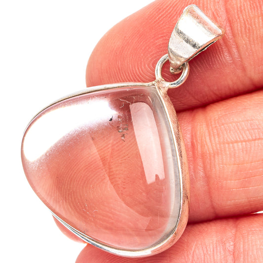White quartz teardrop pendant with silver-plated bezel and bail, close-up