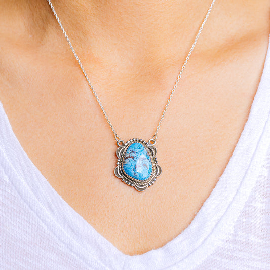 Sterling silver turquoise necklace with oval blue pendant in ornate bezel