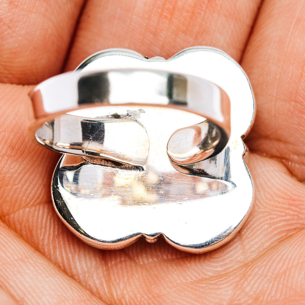 Sterling silver heart-shaped ring band with high polish reflective finish