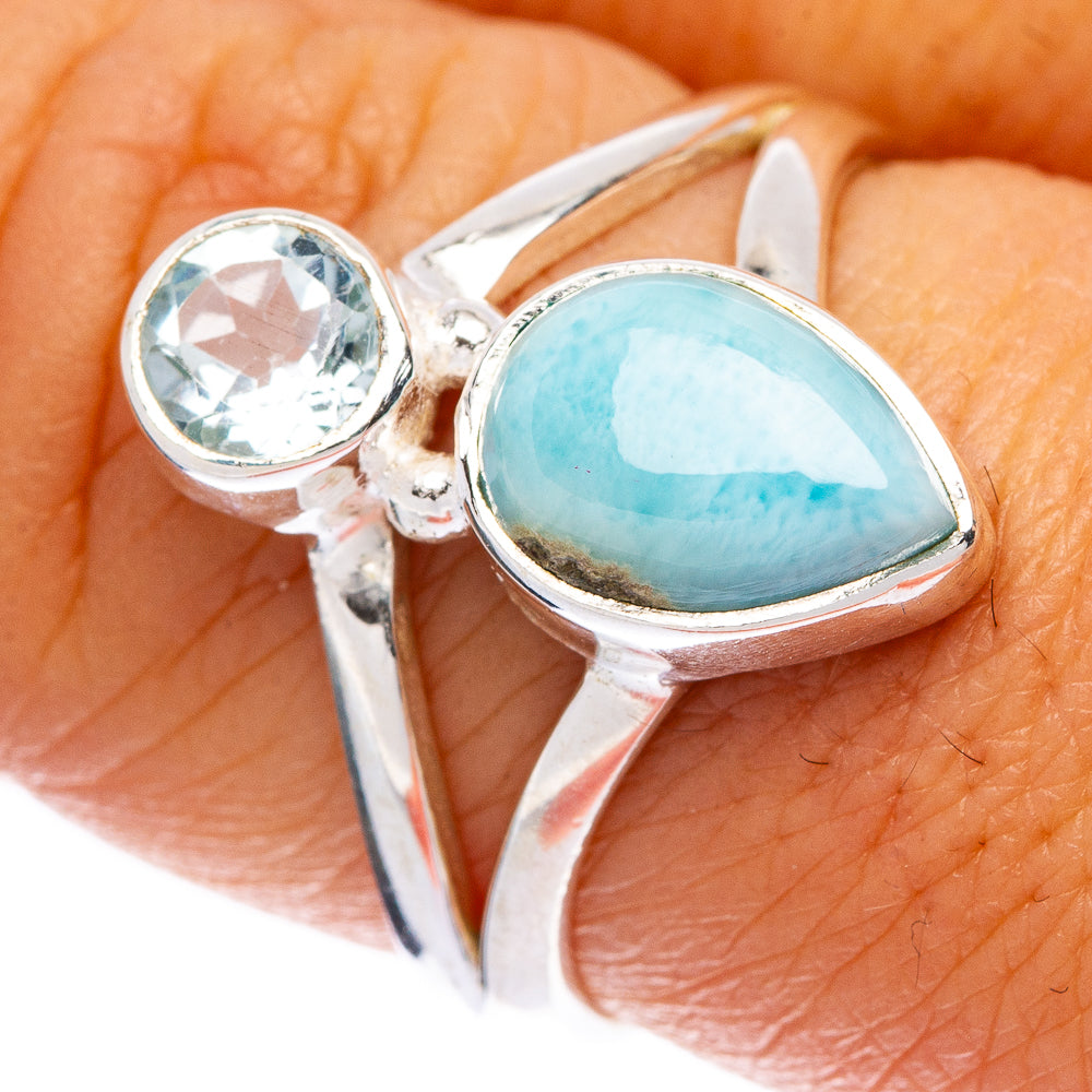 Sterling silver ring with oval light-blue larimar and round blue crystal center