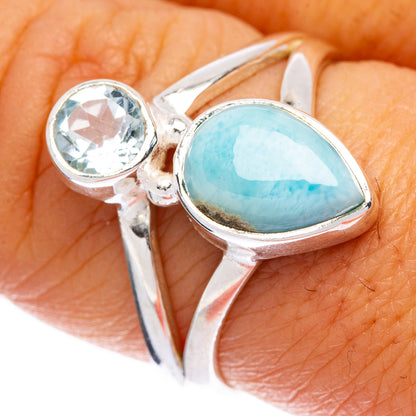 Sterling silver ring with oval light-blue larimar and round blue crystal center