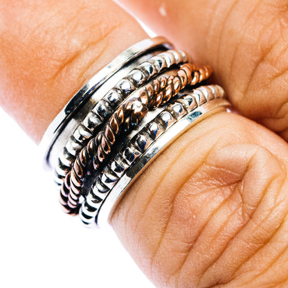 Sterling silver meditation spinner ring with copper-toned engraved bands, size 5.75