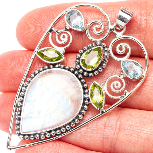 Heart pendant in .925 sterling silver with rainbow moonstone, blue topaz, and peridot stones.