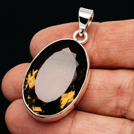 Oval faceted smoky quartz pendant in polished .925 sterling silver bezel setting