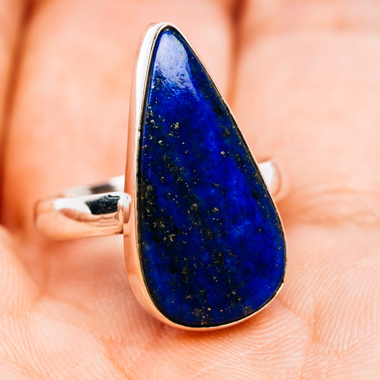 Blue teardrop gemstone ring in .925 sterling silver band, side view on hand