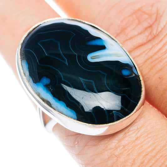 Oval black banded agate ring with .925 sterling silver bezel, top view