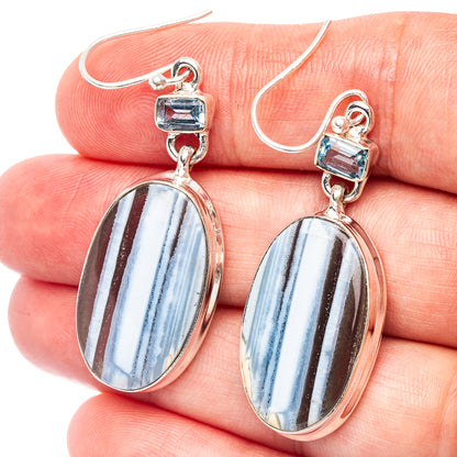 Sterling silver drop earrings with oval blue opal cabochons and blue top accents