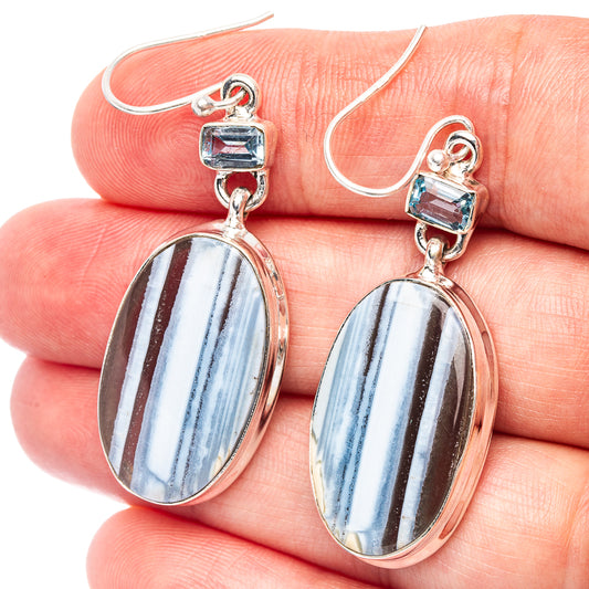 Sterling silver drop earrings with oval blue opal cabochons and blue top accents