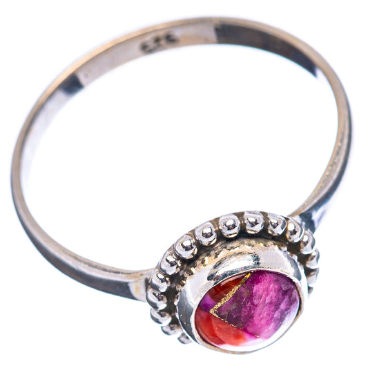 Sterling silver ring side view with round pink gemstone and beaded bezel