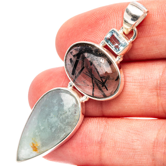 Sterling silver pendant with oval aquamarine, round tourmalinated quartz, blue topaz