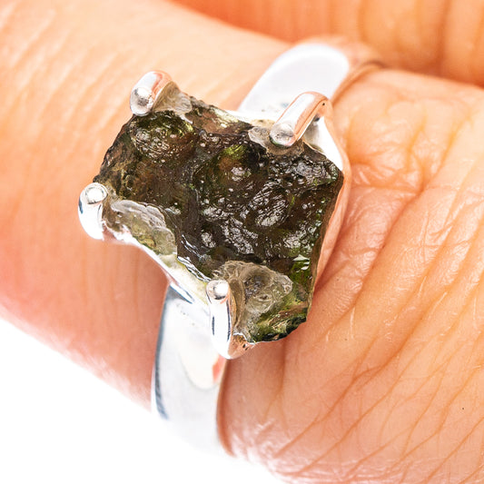 Sterling silver ring with rough green moldavite gemstone on top, three prong set