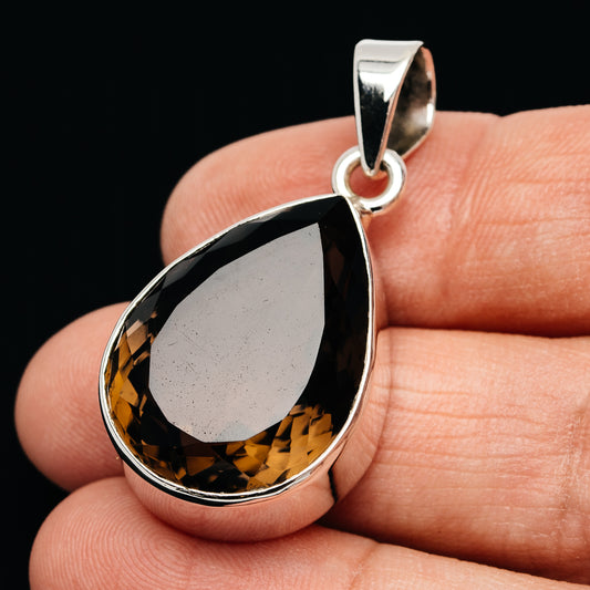 Smoky quartz teardrop pendant in .925 sterling silver bezel with loop bail