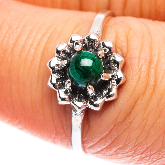 Sterling silver malachite ring with round green gemstone and textured petal halo