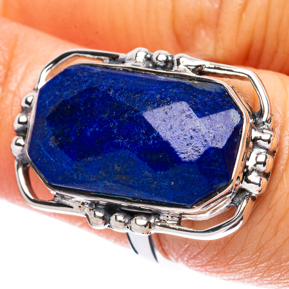 Lapis lazuli oval ring with faceted blue gemstone in ornate sterling silver setting