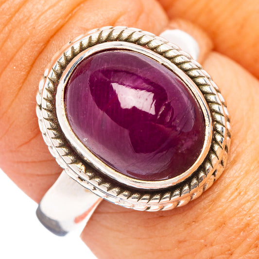 Sterling silver oval ruby ring with rope-textured border and polished bezel