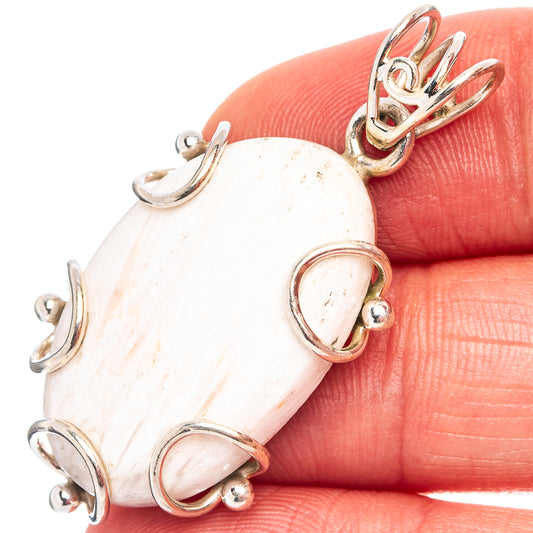 Scolecite pendant in .925 sterling silver, oval cabochon with looped bezel settings