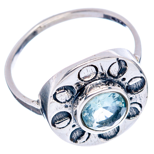 Sterling silver ring with round light-blue gemstone and paw-print style settings