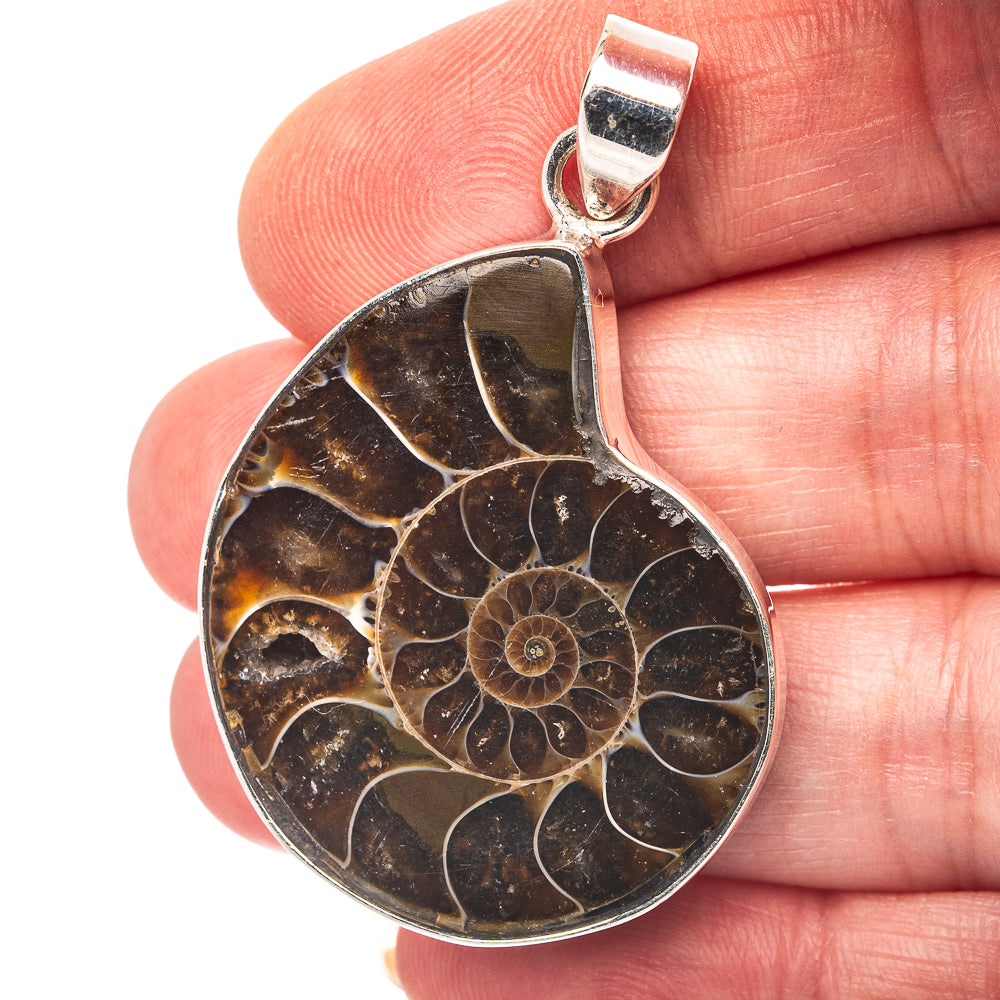 Ammonite fossil pendant in dark brown with gold pattern, .925 sterling silver bezel