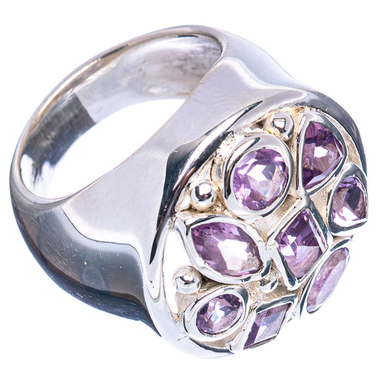 Sterling silver tanzanite ring angled with purple oval stones in an ornate setting