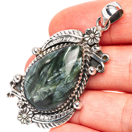 Sterling silver seraphinite teardrop pendant with ornate frame and flower accents