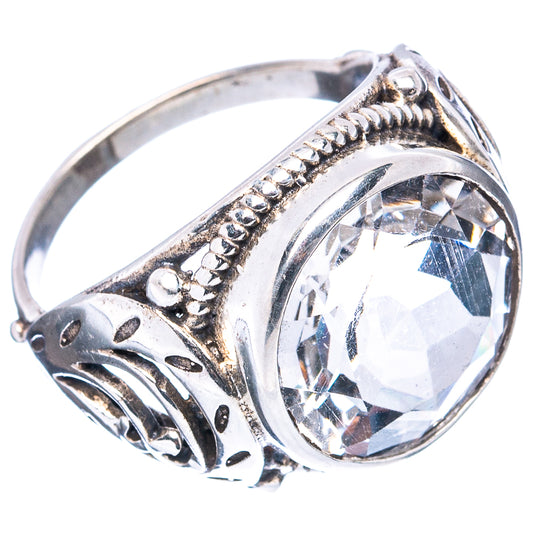 Sterling silver ring with round clear quartz, ornate filigree bezel and side details
