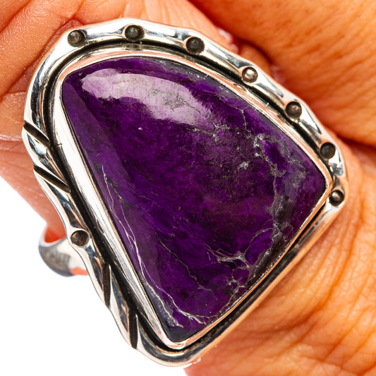 Sterling silver ring with oval purple sugilite gemstone and bezel settings on sides