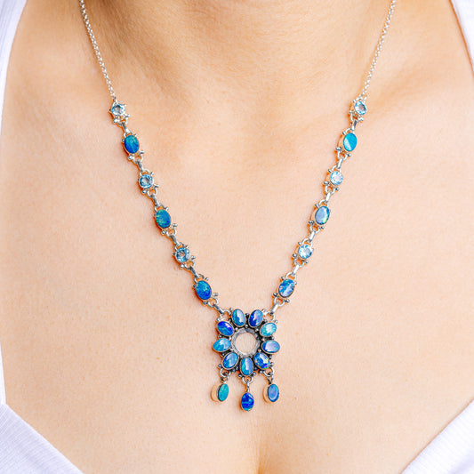 Doublet sterling silver blue opal necklace with teardrop stations and flower pendant
