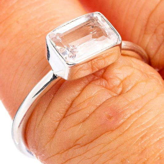 Sterling silver ring with pale pink square-cut gemstone and prong setting