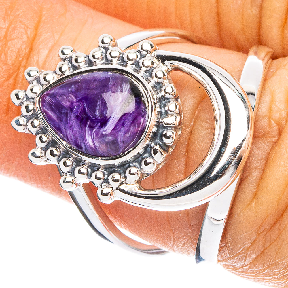 Purple charoite gemstone sterling silver ring with ornate halo setting, open band.