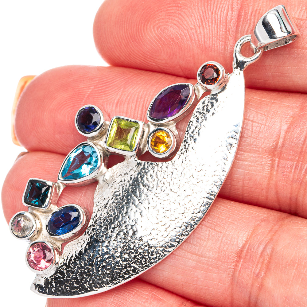925 sterling silver multi-stone pendant with oval blue/purple stones and green yellow accents