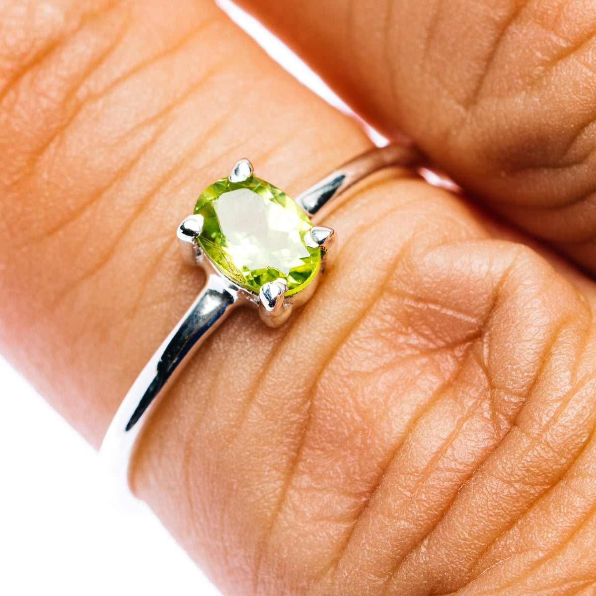 Oval peridot gemstone stackable ring in .925 sterling silver, prong-set on band
