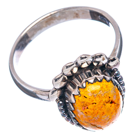 Sterling silver ring with oval honey-orange stone in pronged setting with beaded band