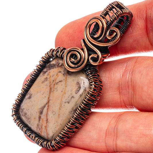 Oxidized copper wire wrap pendant with oval petrified palm root stone