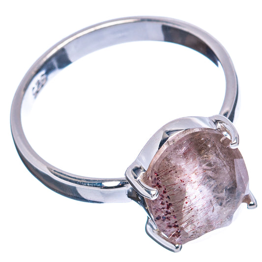 Sterling silver ring with oval pink gemstone and four prongs, side view