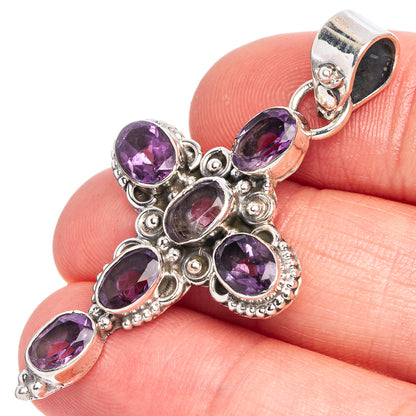 Amethyst cross pendant in 925 sterling silver with faceted purple gemstones