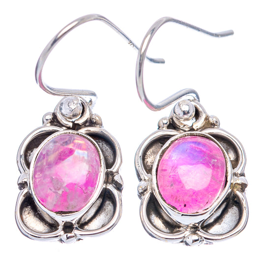 Pink round moonstone stud earrings in .925 sterling silver with ornate flower-like frames.