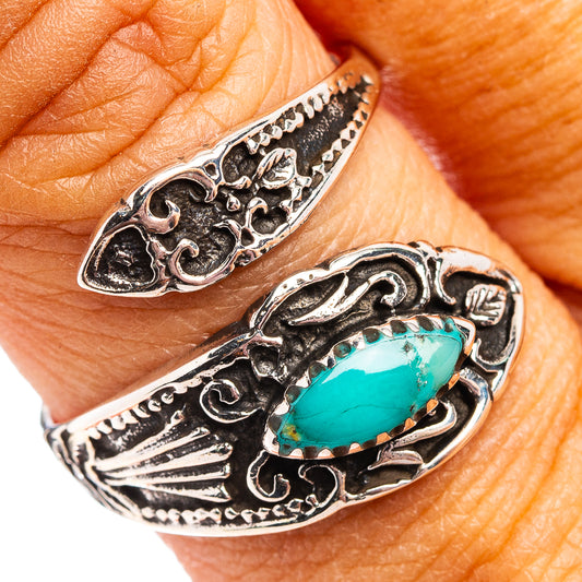 Ornate .925 sterling silver ring with oval turquoise stone and engraved filigree
