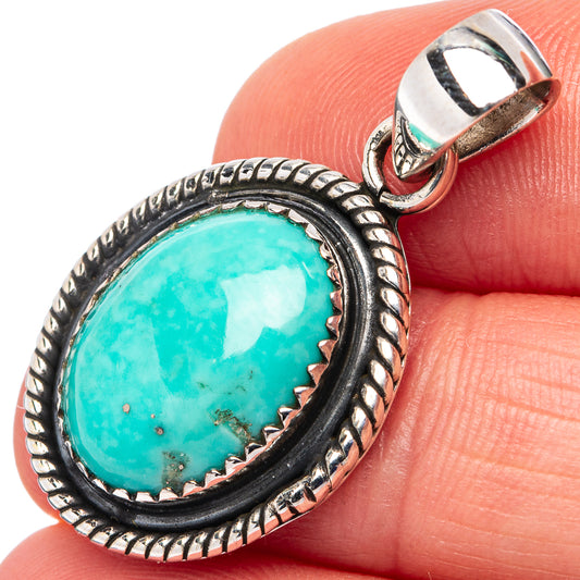 Turquoise cabochon pendant in rope-edged .925 sterling silver bezel with open bail