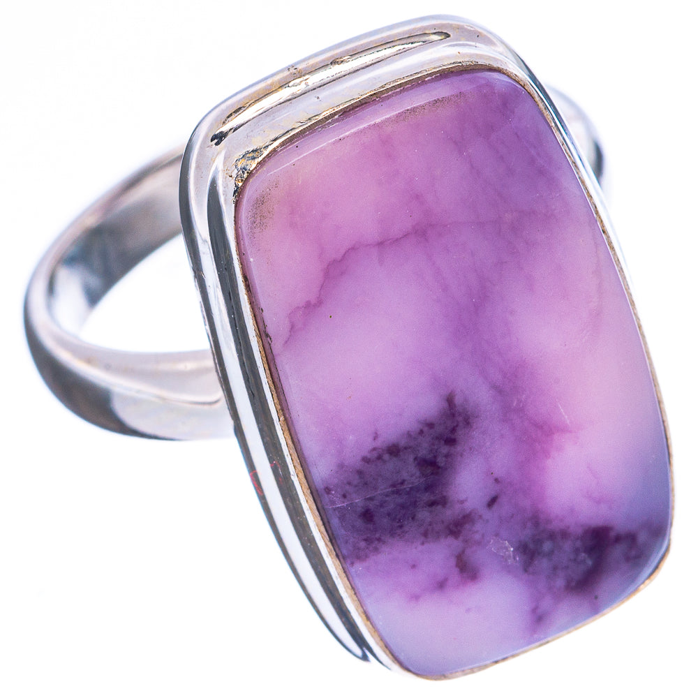 Sterling silver ring with oval purple cabochon and raised bezel, side view