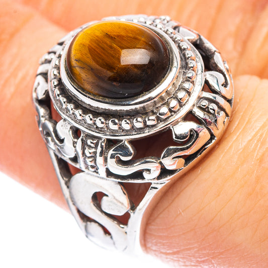 Sterling silver filigree ring with round tiger's eye gemstone, size 7.