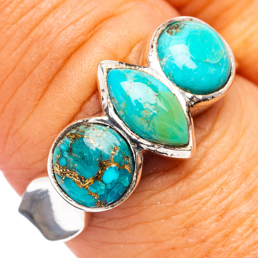 Turquoise cabochon triple-stone ring in .925 sterling silver, close-up on finger