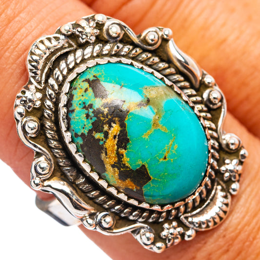 Turquoise oval cabochon sterling silver ring with ornate scroll setting and bead details